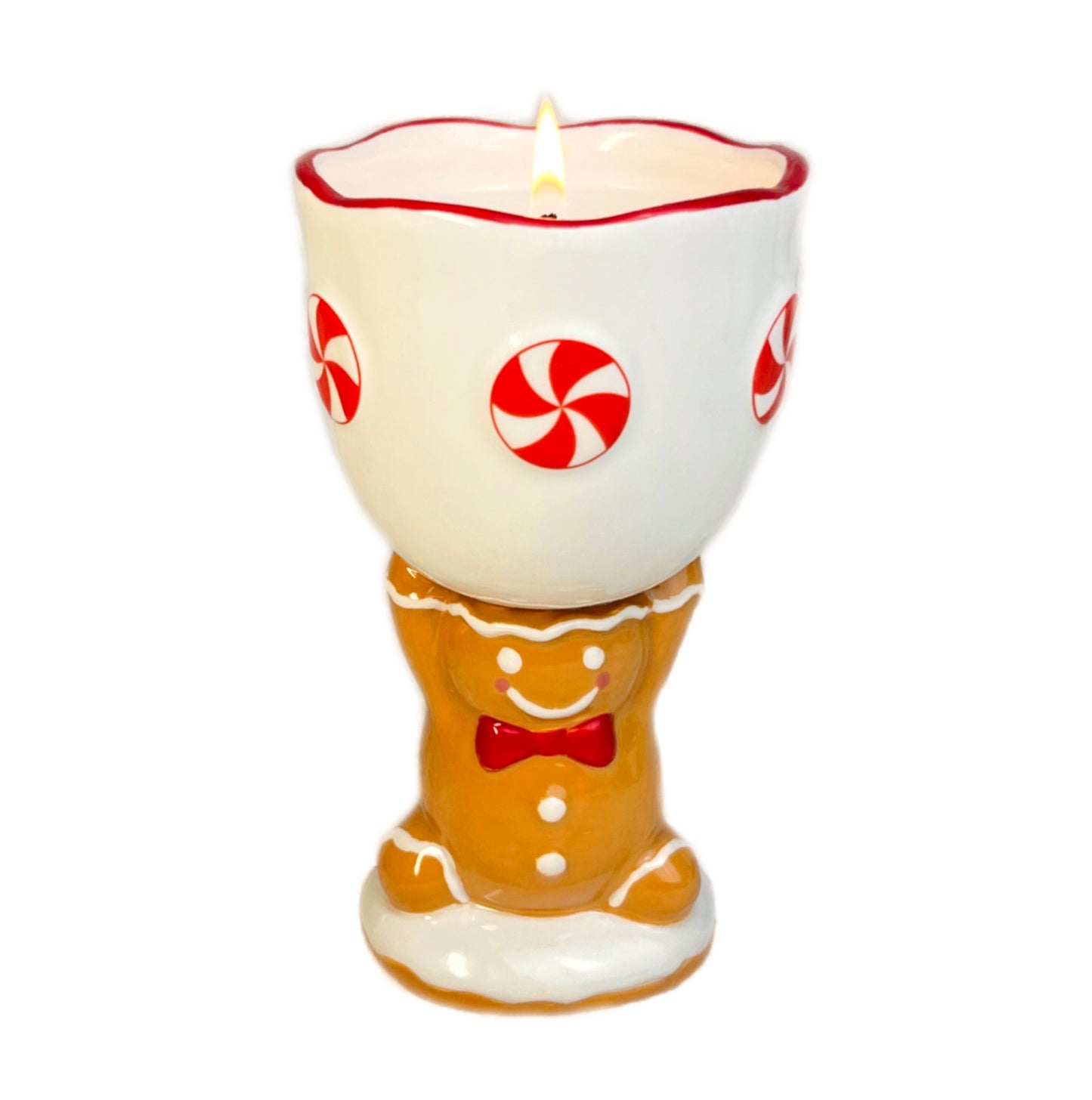 Gingerbread man candle with peppermint candy design on a white background