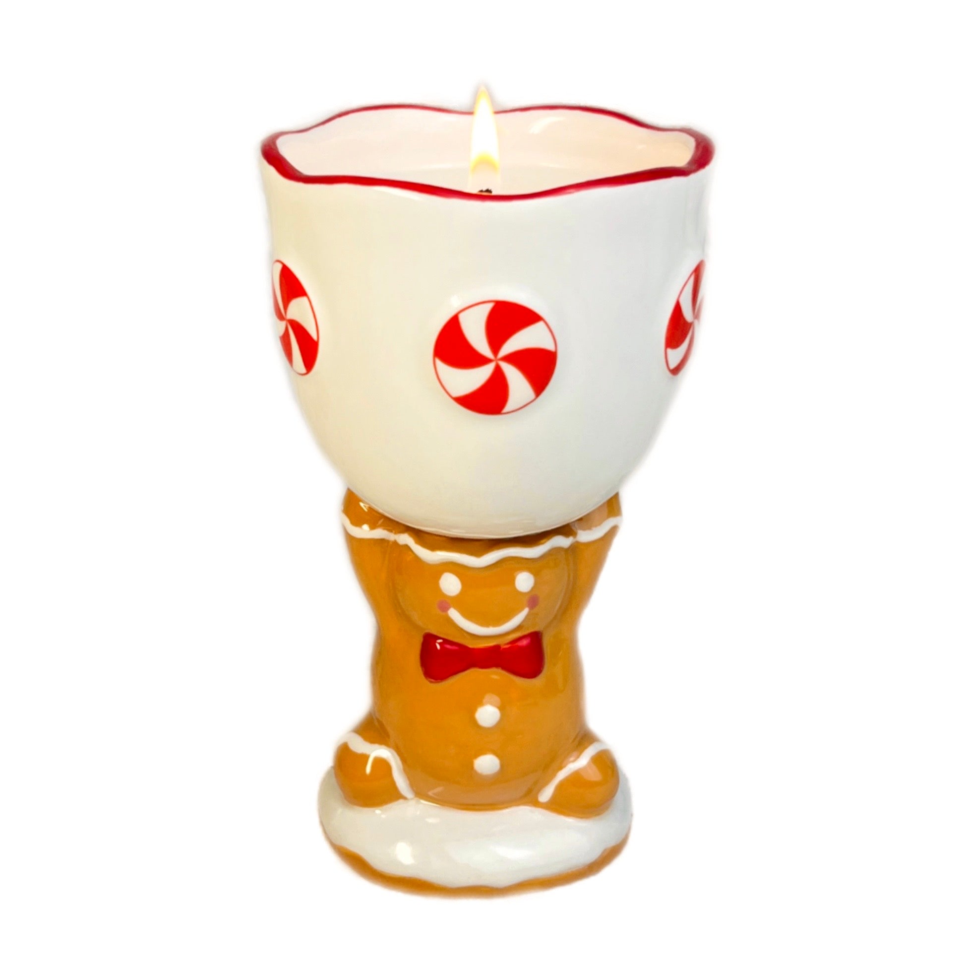 Gingerbread man candle with peppermint candy design on a white background